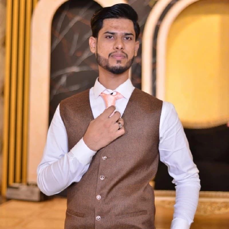 A professional portrait of Abdul Basit.